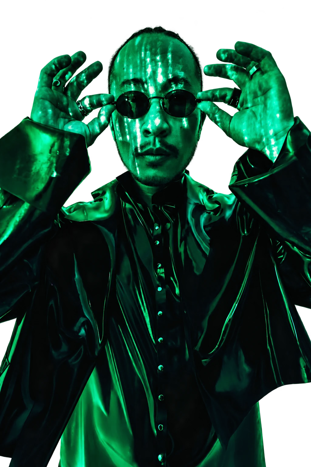 Leven holding his round sunglasses, illuminated by green digital light